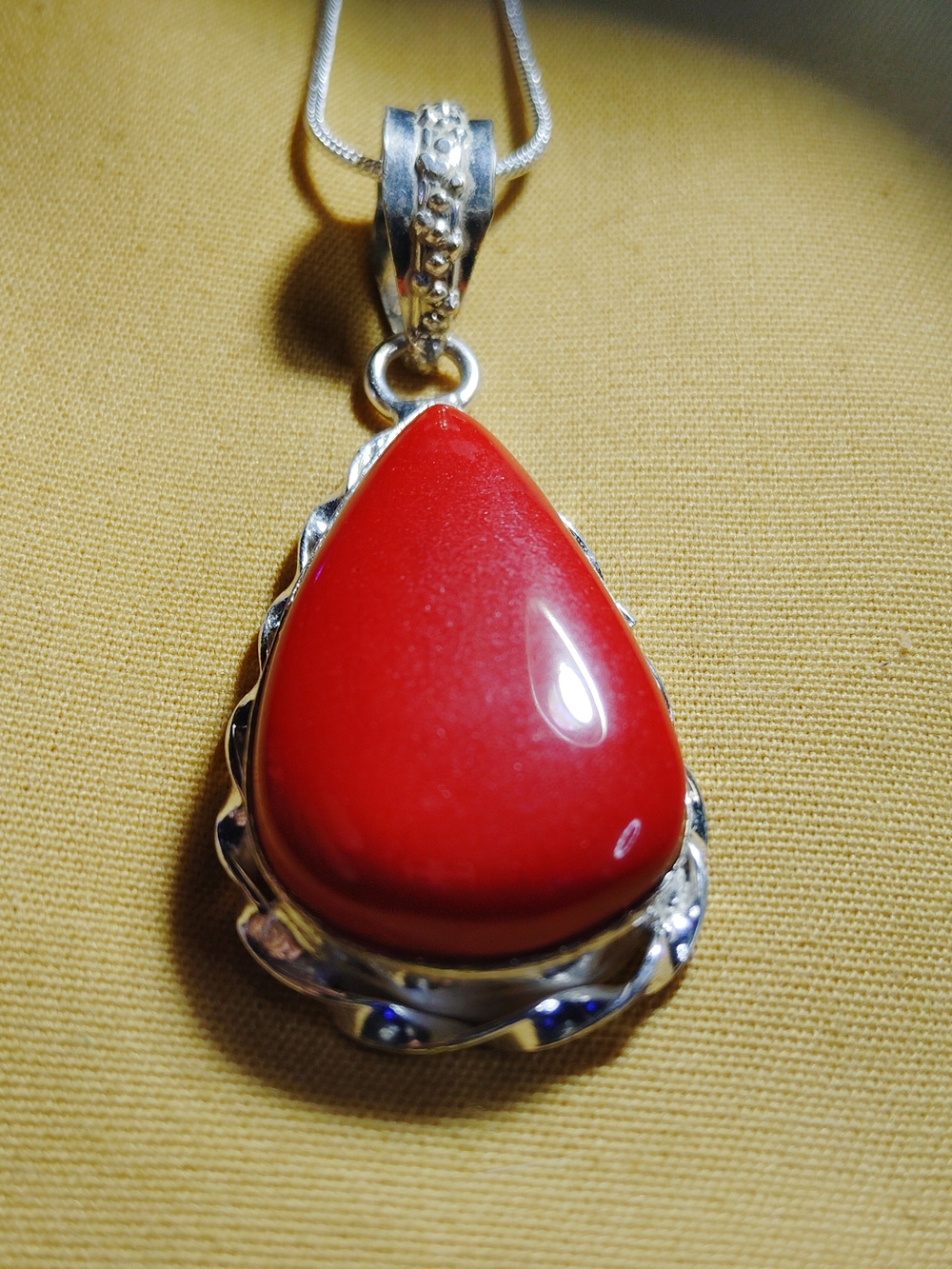 RICH, RED CORAL TEARDROP PENDANT IN SOLID STERLING SETTING. 18" CH.